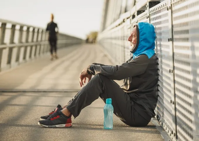 Athlete resting between sets of a graded post-operative loading programme